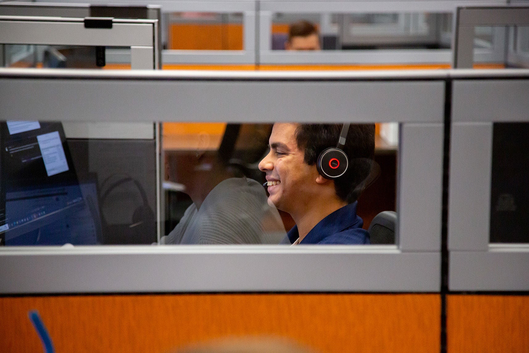 toyota office employee smiling through glass